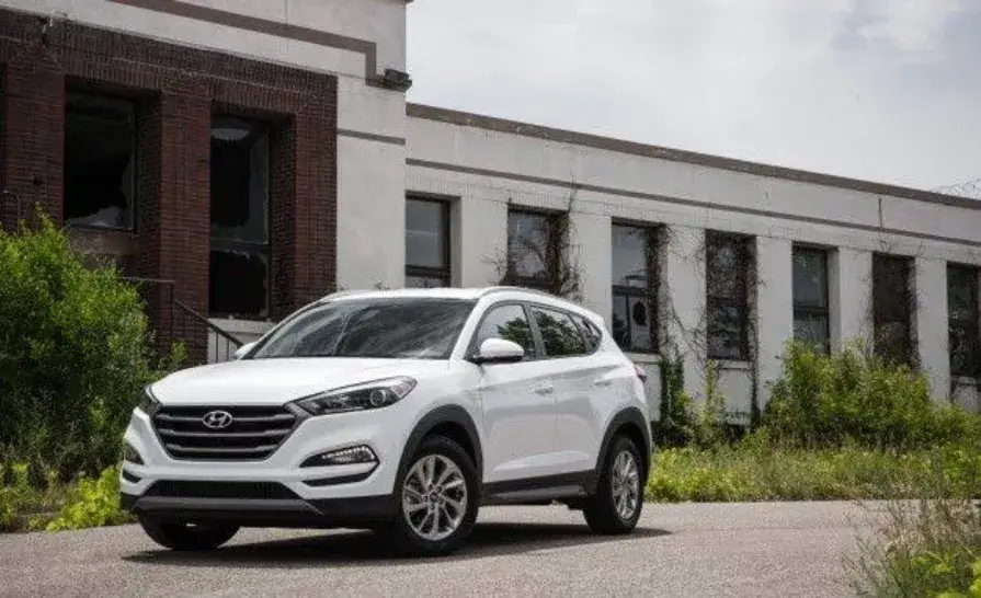 Hyundai Tucson SUV on display with fine print overlay, symbolizing the CCP's Rs 25 million fine for misleading introductory pricing in Pakistan.