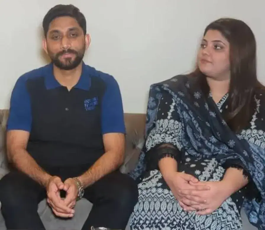 A heartfelt moment showing a Pakistani man holding hands with his recovering wife in a hospital room after donating 60% of his liver, symbolizing love, sacrifice, and hope.