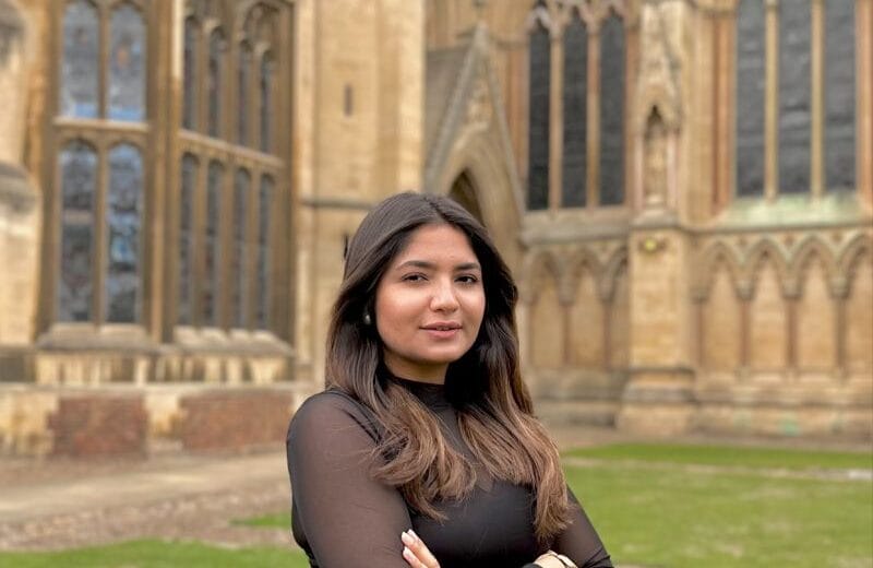 Dr. Maheera Abdul Ghani standing at Cambridge University after becoming the first Pakistani woman to earn a PhD in Material Science