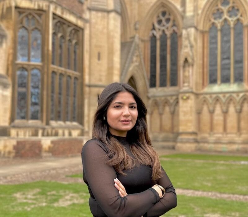 Dr. Maheera Abdul Ghani standing at Cambridge University after becoming the first Pakistani woman to earn a PhD in Material Science